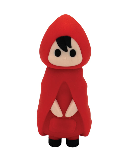 Toy figure of a character in a red hooded cloak on a white background